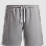 Men's solid color textured elastic waist shorts