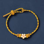 Buddha Stones Yellow Braided Rope Flower Rootedness Bracelet