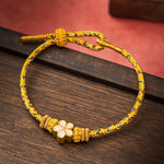 Buddha Stones Yellow Braided Rope Flower Rootedness Bracelet