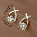 Stud earrings with golden cross and zirconia
