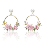 Elegant Gold Earrings with Flowers and Pearls