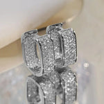 Pavelina Huggie Hoop Earrings